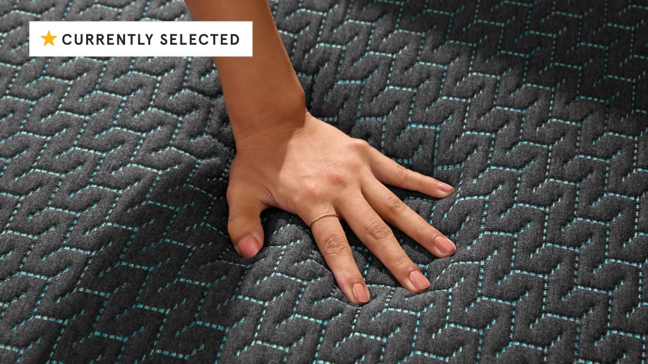 Hand pressing textured mattress surface