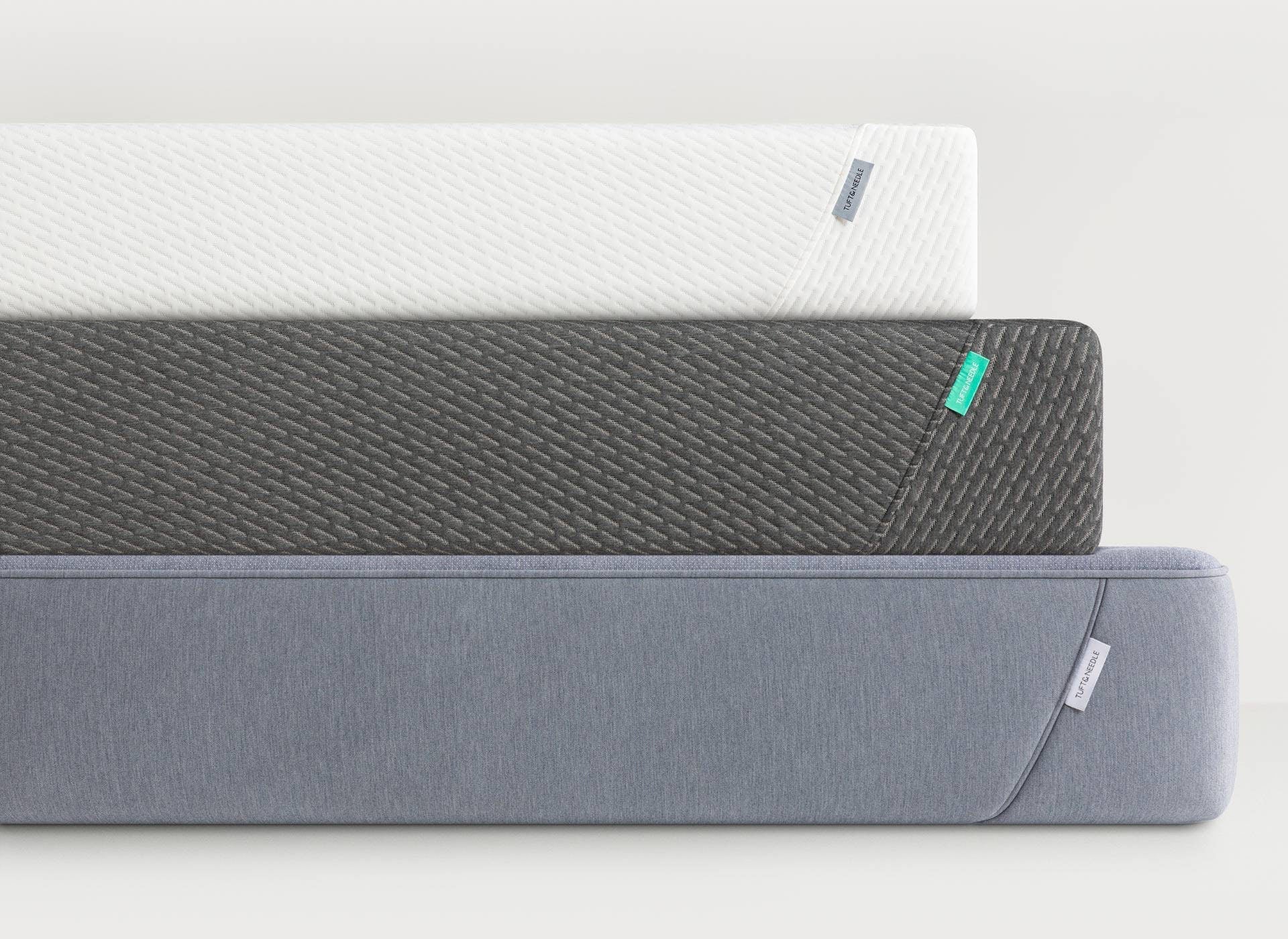 Stacked modern mattresses in neutral tones