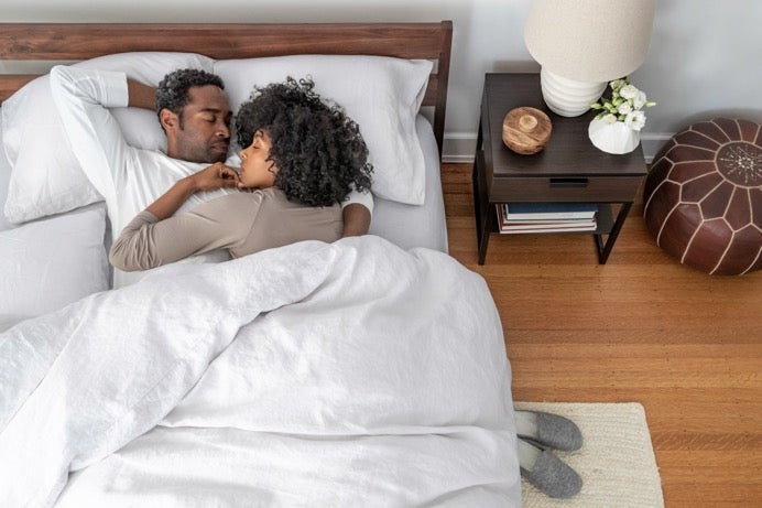 Couple relaxing in cozy bedroom setting