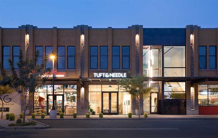 Tuft & Needle storefront at dusk