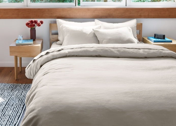 Cozy beige bedding in modern bedroom