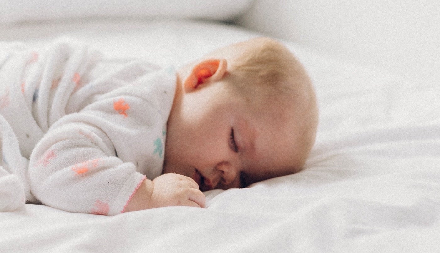 Sleeping baby in soft pajamas