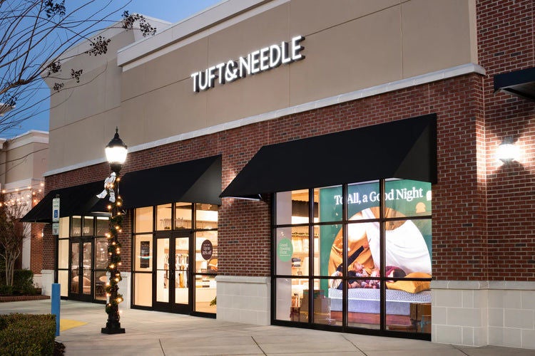 Tuft & Needle storefront at dusk