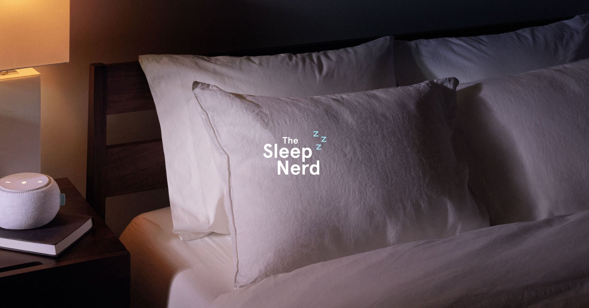 Cozy bed setup with smart speaker