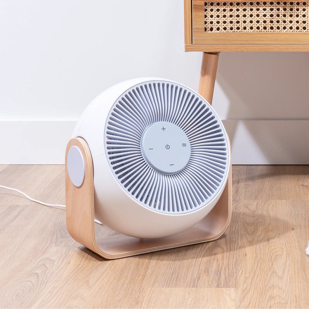 Modern tabletop air purifier in wooden stand
