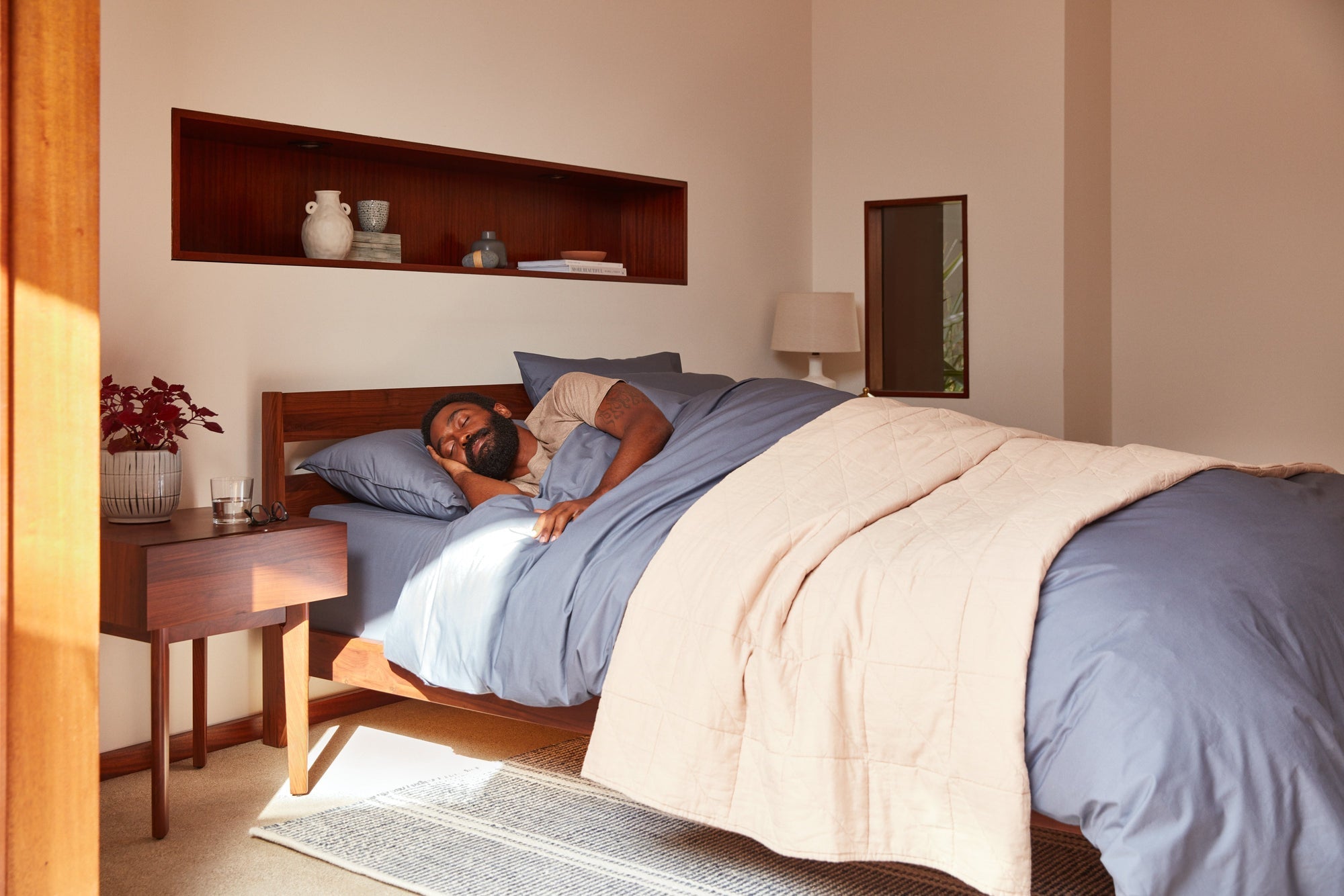 Man sleeping in cozy bedroom setting