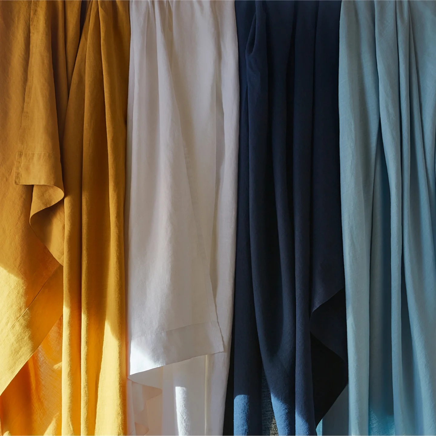 colorful fabric drapes in sunlight