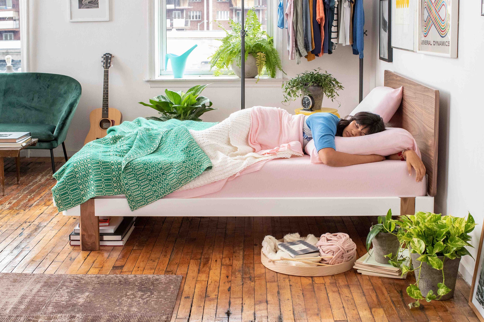 Woman sleeping in cozy modern bedroom