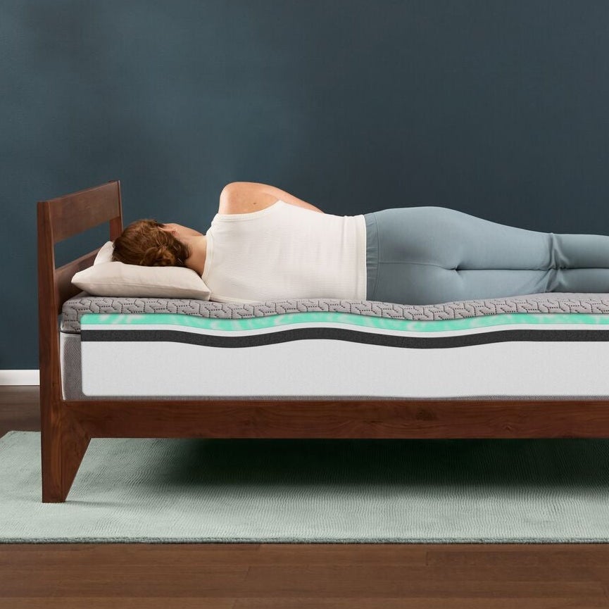 Woman sleeping on memory foam mattress