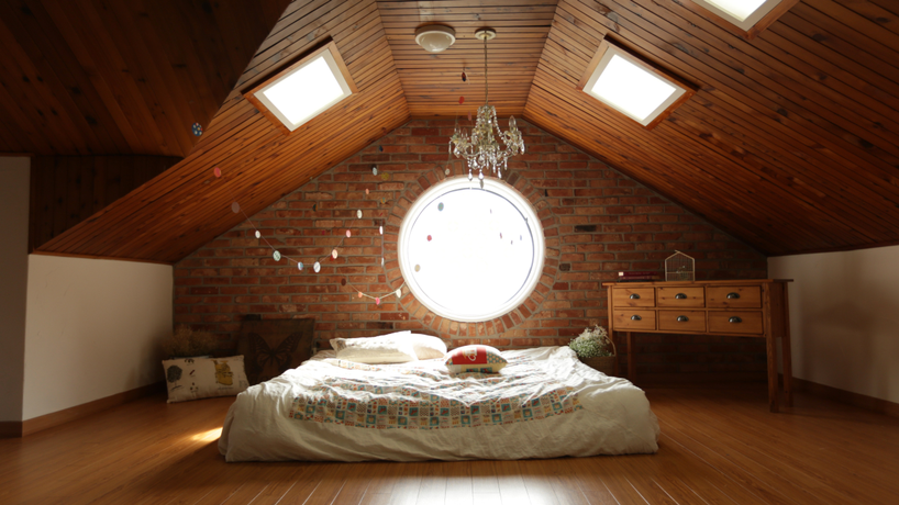 Cozy attic bedroom with natural light