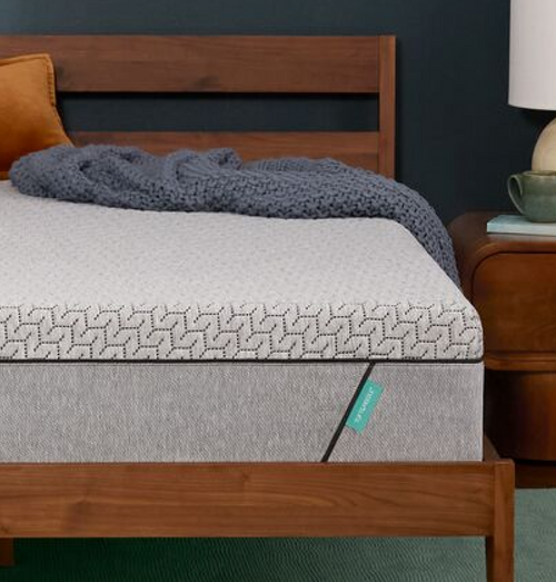 Modern mattress on wooden bed frame