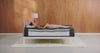 Woman relaxing on modern mattress