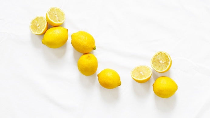 Fresh lemons on white background