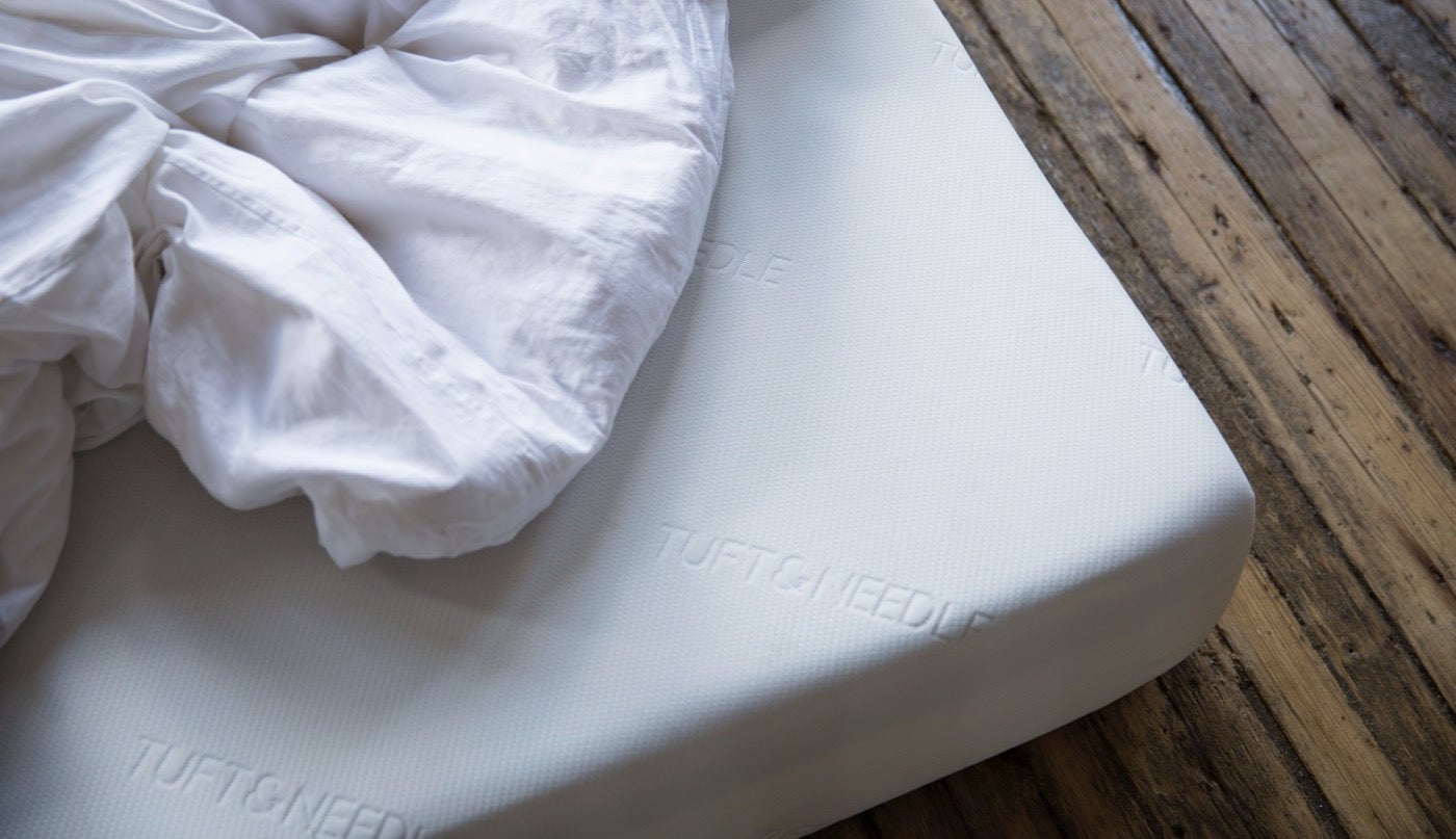 Tuft & Needle mattress on wooden floor