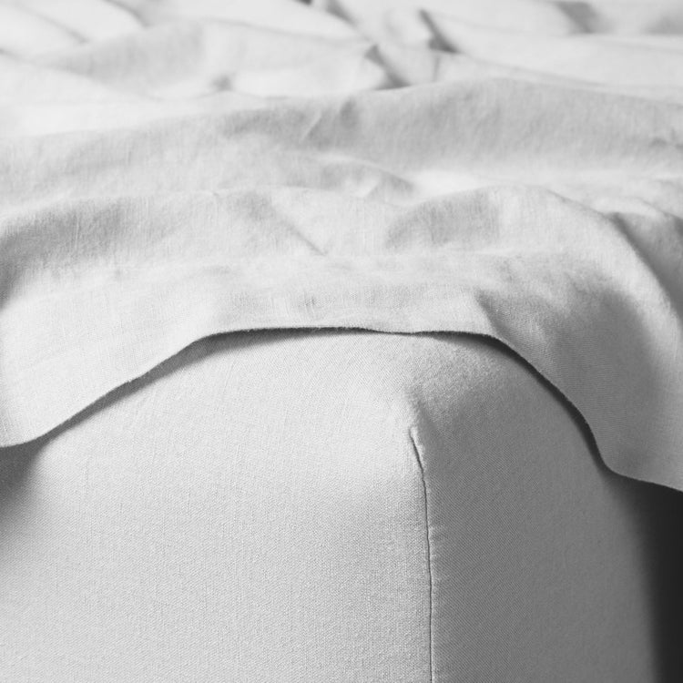 White Linen Fabric on Bed Corner