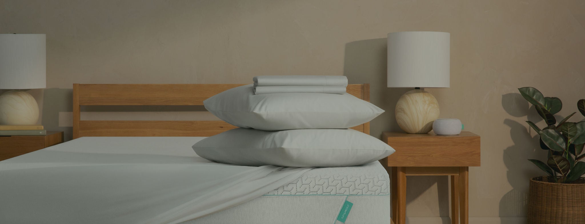 Modern bedroom with neatly stacked pillows