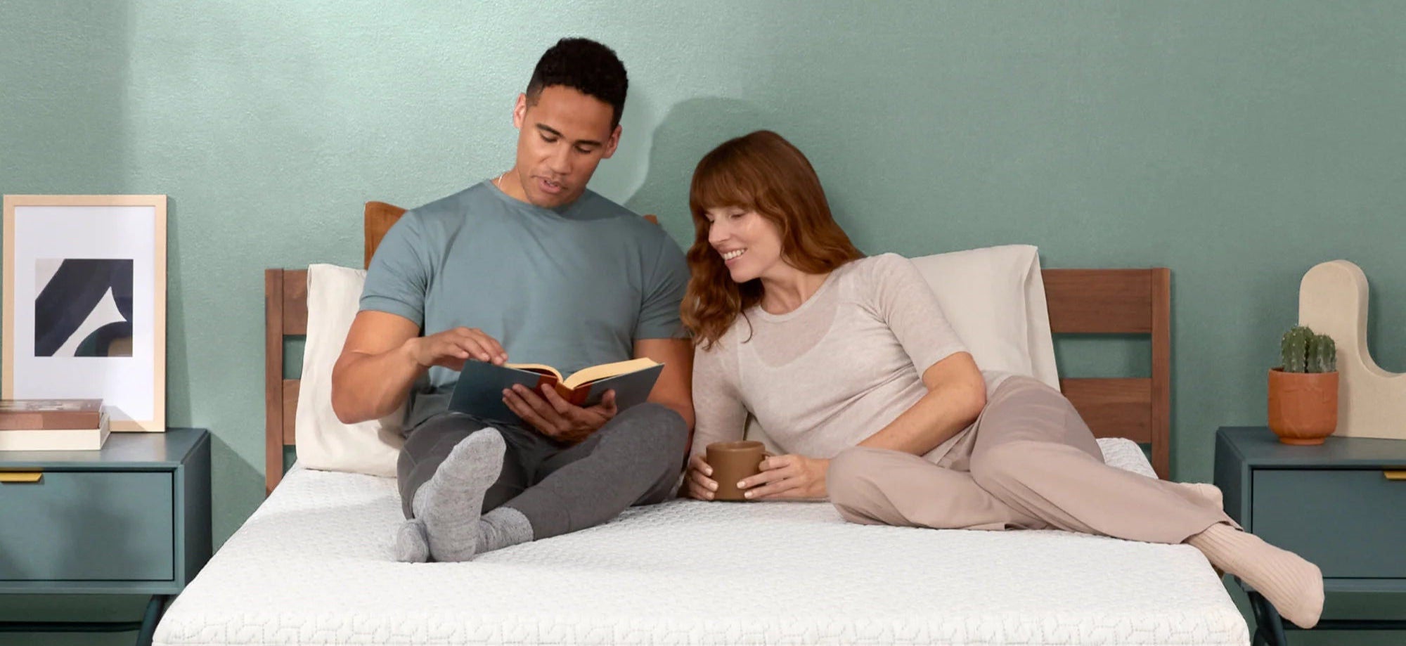 Couple relaxing on modern bed setup