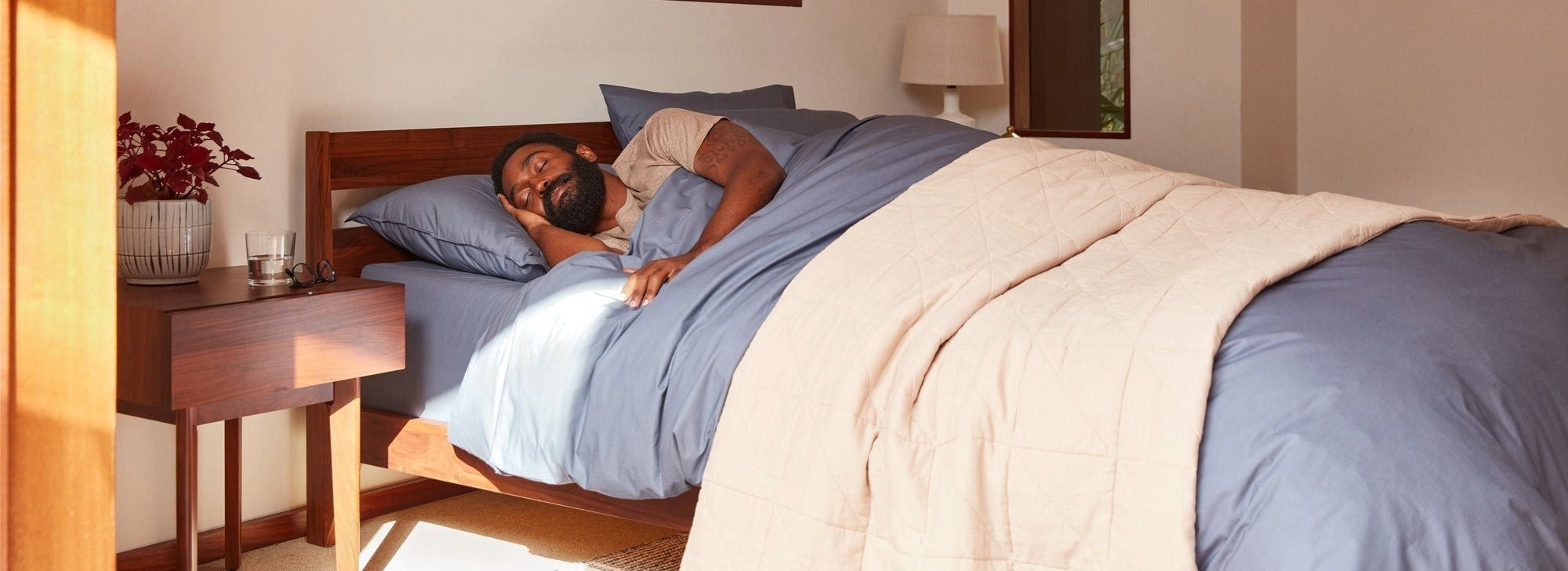 Man sleeping in cozy bedroom setting