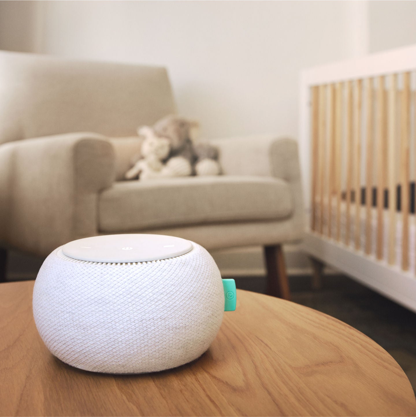 Compact white speaker in nursery setting