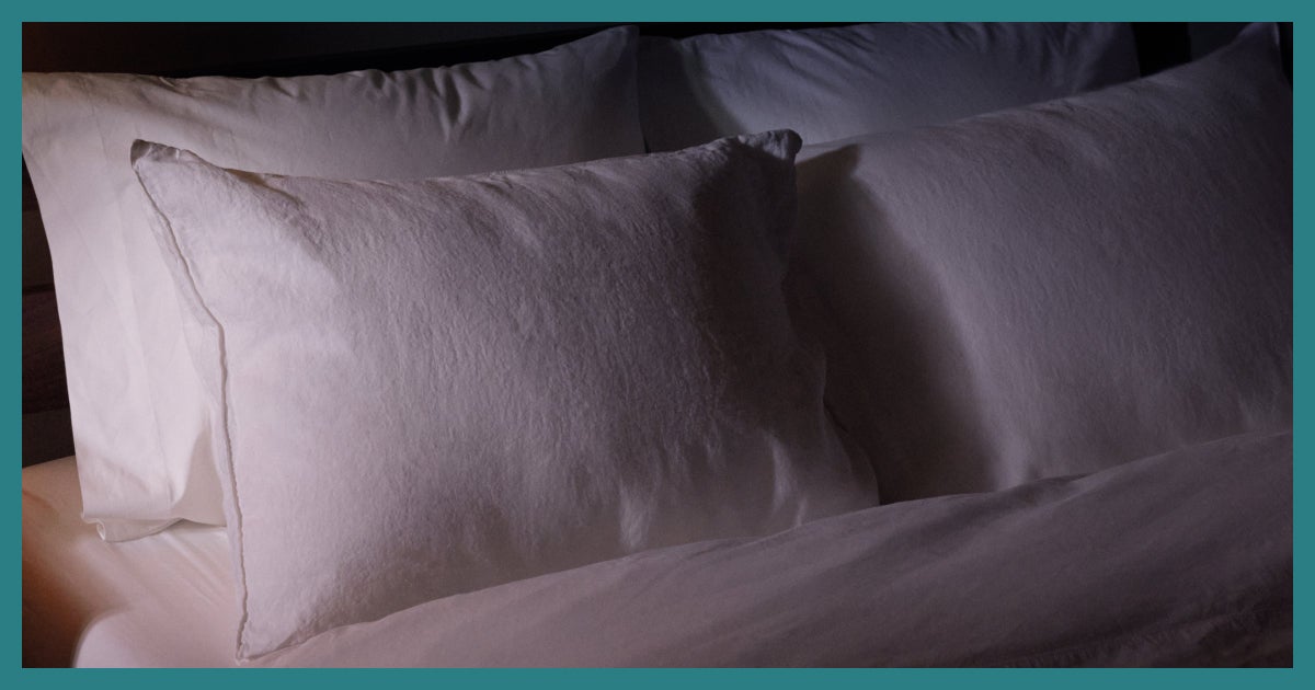 Soft white pillows on a bed