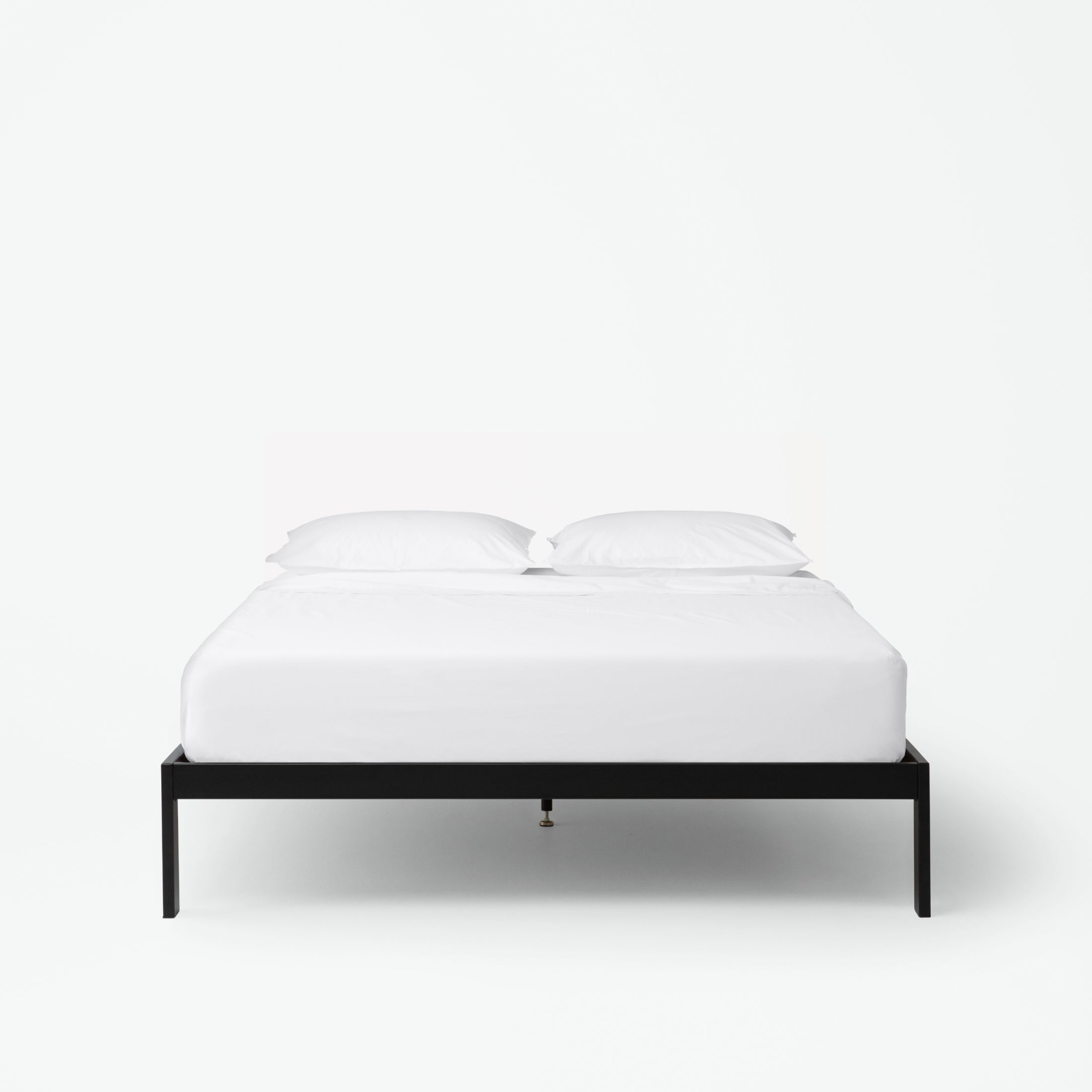 The Tuft and Needle Essential Platform Bed Frame with a mattress||color:black