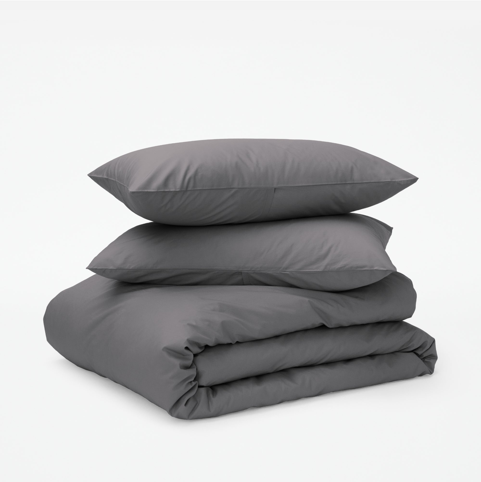The Tuft and Needle Classic Percale Duvet Set, two pillows stacked on top of a sheet set || color: Gray Quill