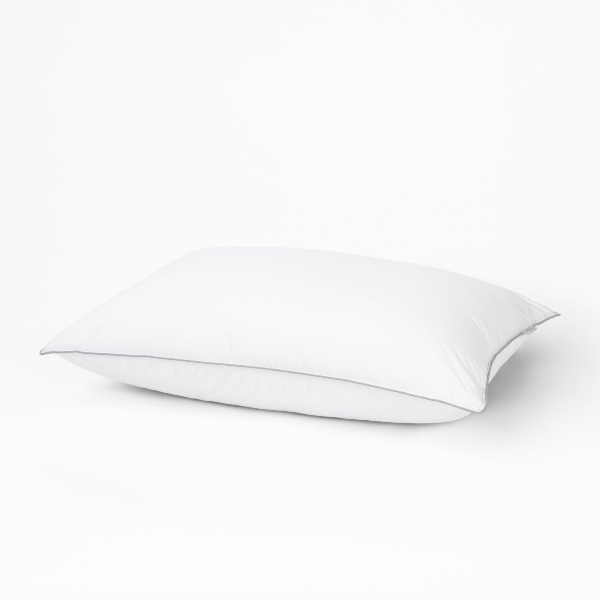 A pillow with the Tuft and Needle Down Alternative Pillow case