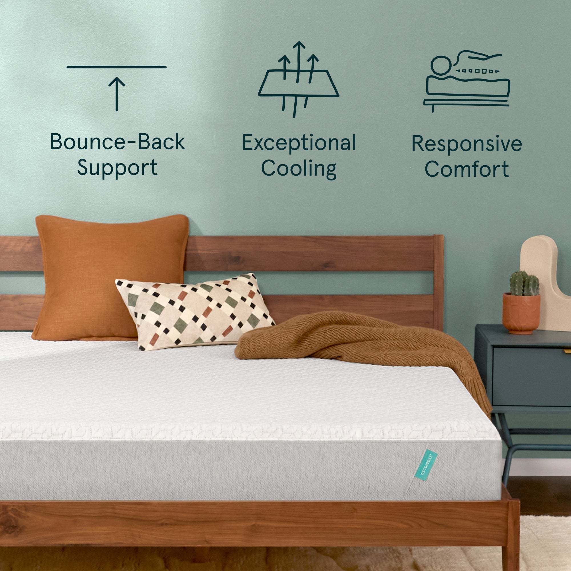 Tuft & Needle Original Mattress sitting in a brown bedframe with 2 pillows on top of it and a brown blanket with a chart on the wall showing icons reflecting Bounce-Back Support, Exceptional Cooling and Responsive Comfort